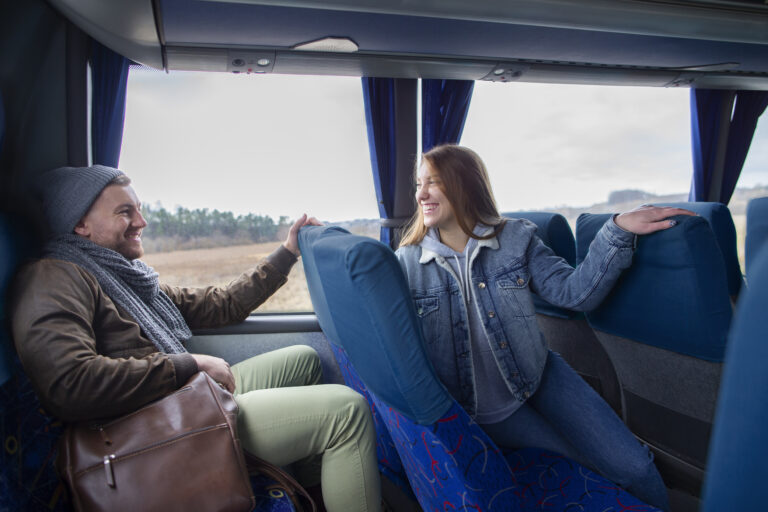 Passengers riding in a shuttle bus for safe transportation.